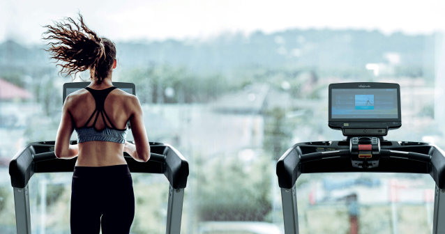Trainer and Treadmills in Gym