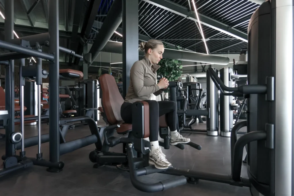 User working out on Selectorized Design Line Hip Adductor / Abductor at Body Dynamics